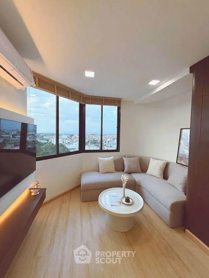 Modern living room with panoramic city view and cozy sectional sofa