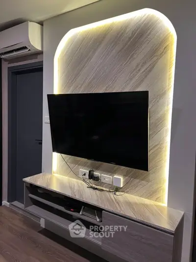 Modern living room with stylish TV setup and ambient lighting