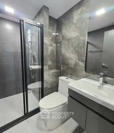 Modern bathroom with sleek design and glass shower enclosure