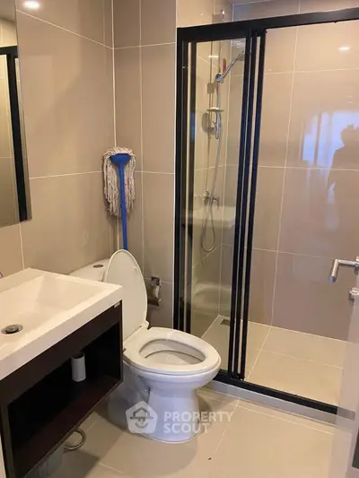 Modern bathroom with glass shower and sleek fixtures