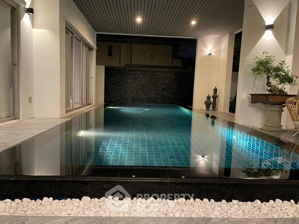 Luxurious modern home with stunning private pool and elegant lighting