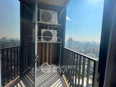 High-rise balcony with city view and air conditioning units, perfect for urban living.
