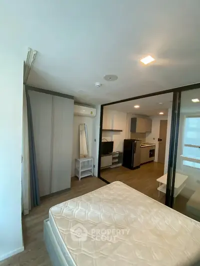 Modern studio apartment with open layout and stylish kitchen