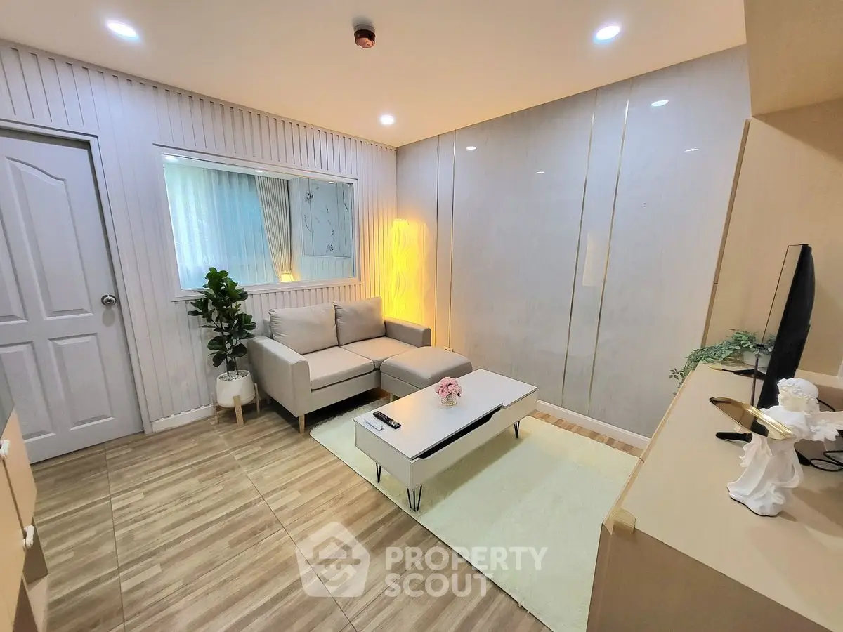 Modern living room with cozy sofa and stylish decor