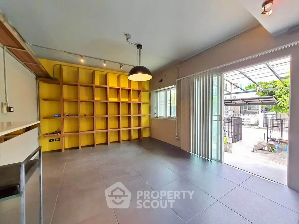 Spacious living room with modern open layout and large windows for natural light.