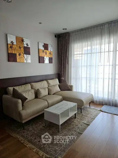 Stylish living room with modern decor and large windows for natural light