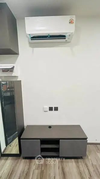 Modern living room with sleek air conditioning unit and stylish furniture