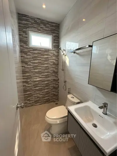 Modern bathroom with sleek design and stylish tile accents