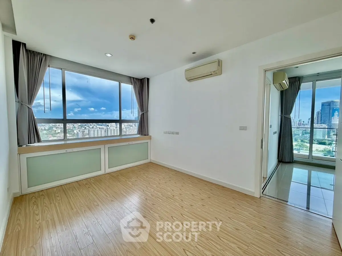 Spacious corner unit with stunning city views and modern wood flooring