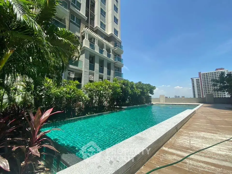 Luxurious rooftop pool with city views in modern high-rise building