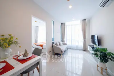 Modern living room with sleek design, bright natural light, and stylish furnishings in a contemporary apartment.