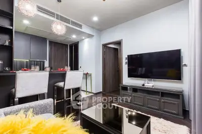 Modern living room with sleek furniture and open kitchen layout, perfect for stylish urban living.