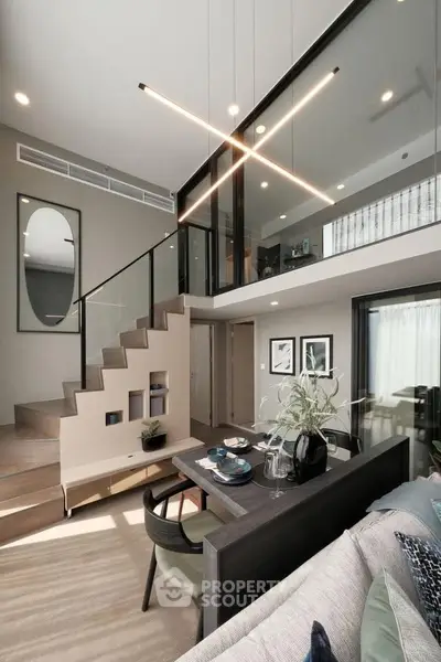 Modern duplex living room with stylish decor and high ceilings