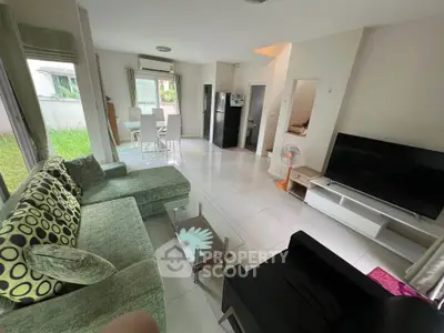 Spacious living room with modern decor and garden view