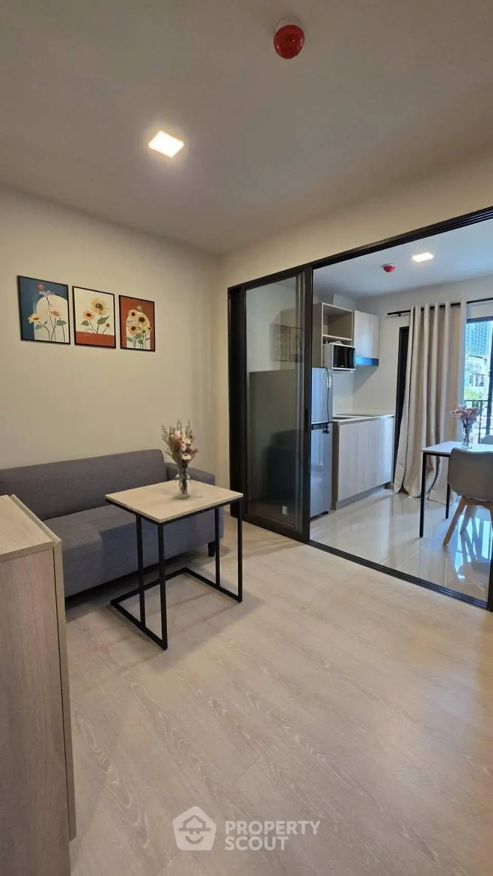 Modern living room with open layout and stylish decor in a contemporary apartment.