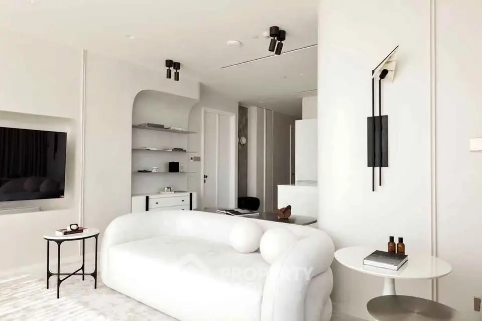 Elegant modern living room with minimalist white decor and stylish furniture