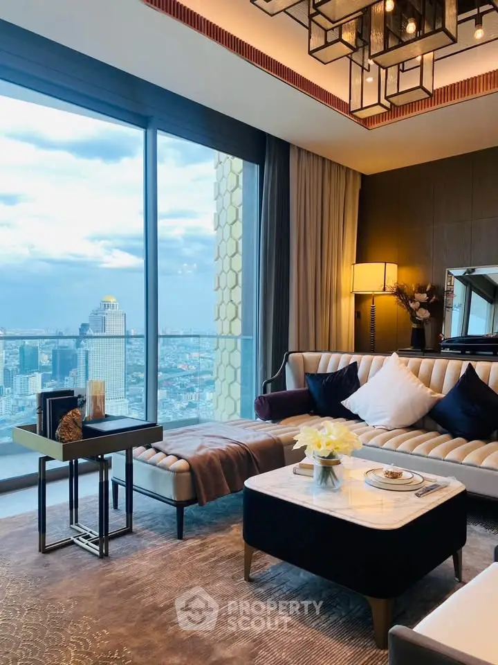 Luxurious living room with stunning city view and modern decor in high-rise apartment.