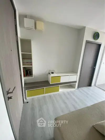 Modern living room with sleek storage and minimalist design