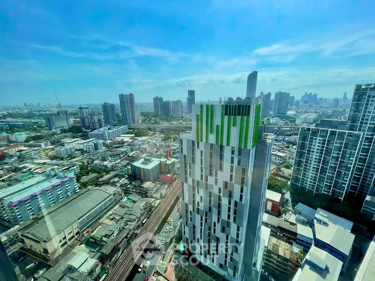 Stunning cityscape view from high-rise building with modern architecture and vibrant skyline.