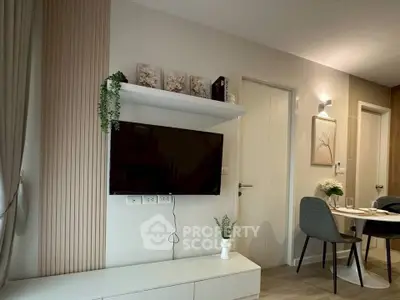 Modern living room with wall-mounted TV and elegant dining area