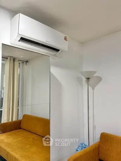 Cozy living room with modern air conditioning and stylish furniture