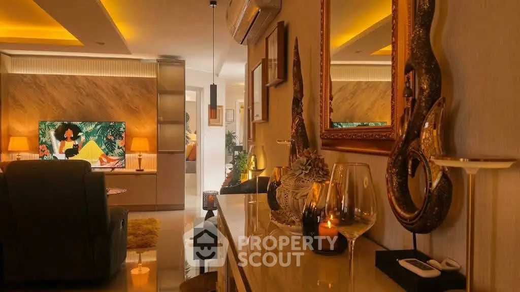 Luxurious living room with elegant decor and ambient lighting, featuring a modern entertainment setup.
