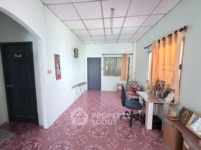 Charming home office space with natural light and decorative flooring