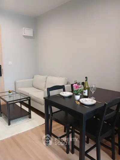 Cozy living room with dining area, modern furniture, and stylish decor