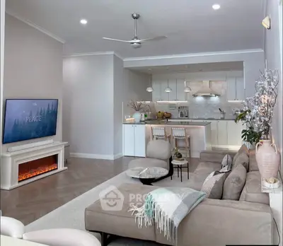 Modern living room with cozy sectional sofa, stylish kitchen, and elegant decor in open-concept layout.