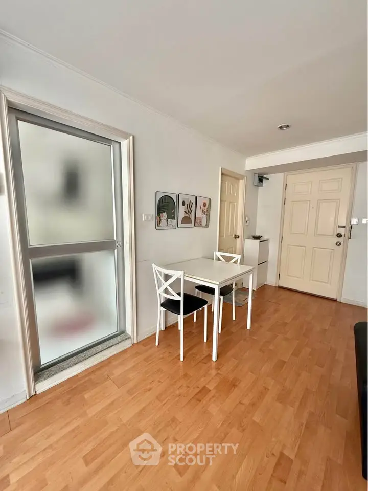 Charming dining area with wooden flooring and modern decor