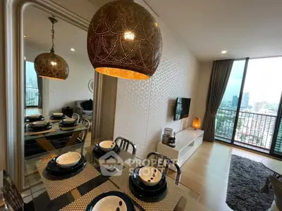 Modern dining area with elegant decor and city view from balcony in luxury apartment