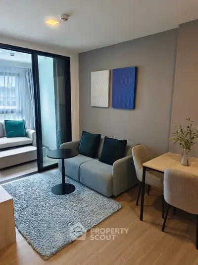 Modern living room with cozy seating and stylish decor in a contemporary apartment.