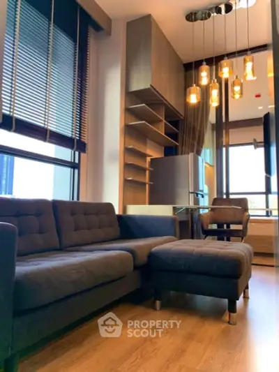 Modern living room with stylish furniture and elegant lighting in a contemporary apartment.