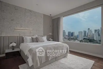 Luxurious bedroom with stunning city view in modern high-rise apartment.