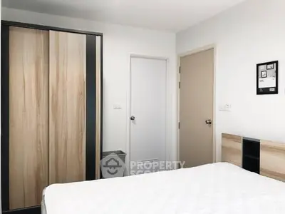Modern bedroom with sleek wardrobe and minimalist design