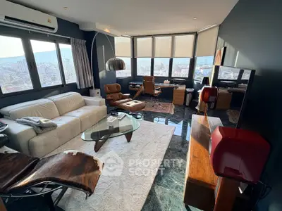 Luxurious living room with panoramic city views and modern furnishings