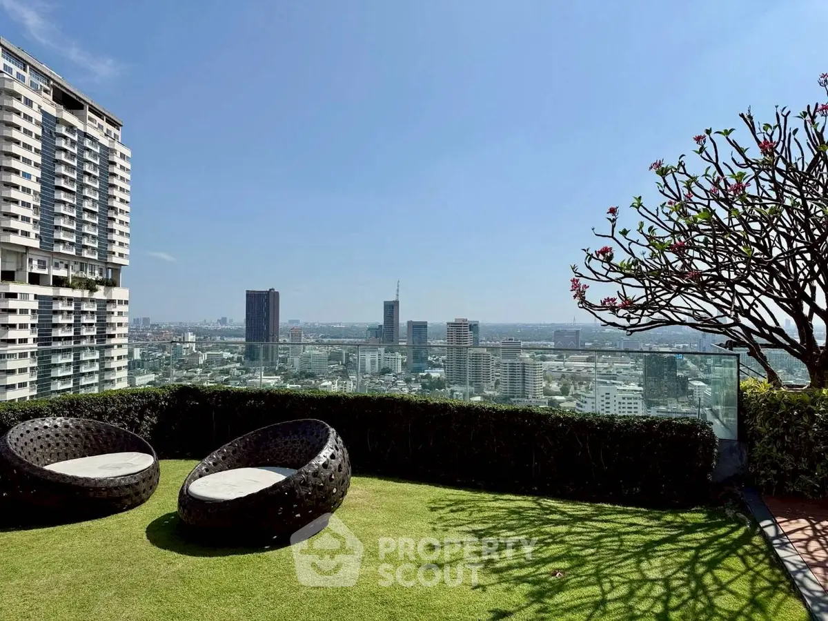Stunning rooftop garden with panoramic city views and modern seating area.