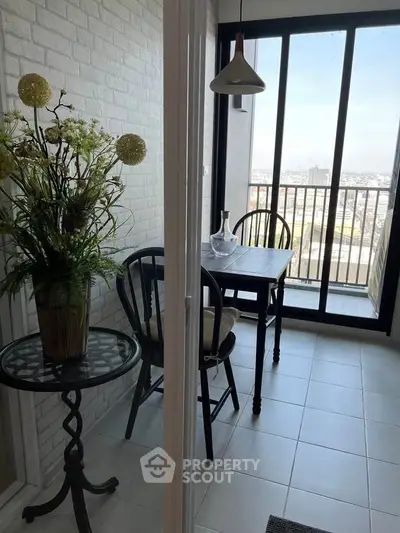 Charming balcony with city view, featuring cozy seating and elegant decor, perfect for relaxation.
