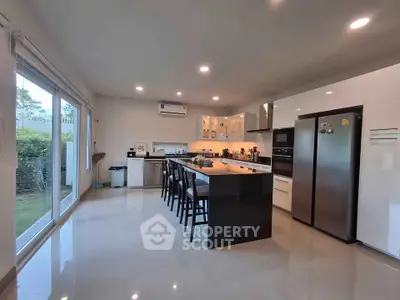 Spacious modern kitchen with sleek design and ample natural light