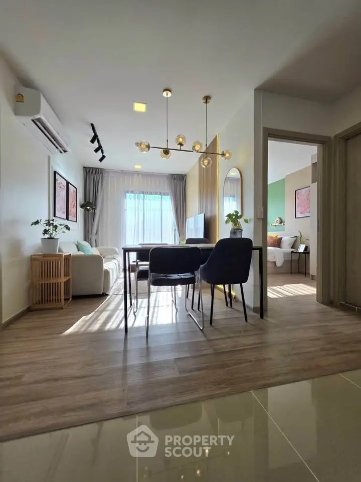 Modern open-plan living room with stylish decor and natural light