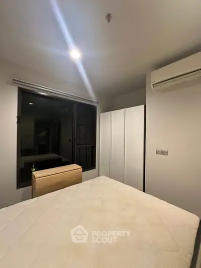 Cozy bedroom with modern air conditioning and ample closet space