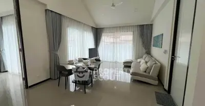 Spacious modern living room with elegant dining area and natural light
