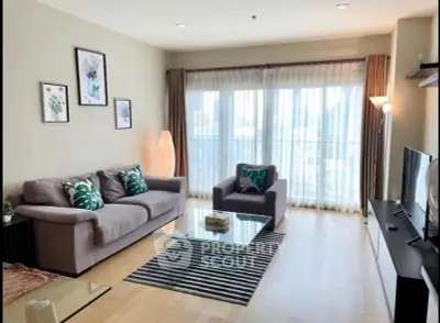 Spacious modern living room with large windows and stylish decor