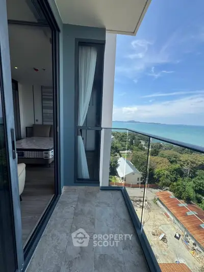 Stunning balcony with ocean view in modern high-rise apartment