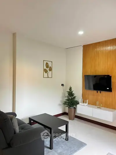 Modern living room with wall-mounted TV and stylish decor