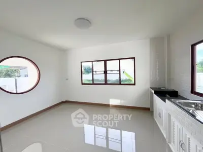 Spacious kitchen with modern design and large windows for natural light
