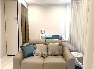 Modern studio apartment with cozy living area and stylish decor