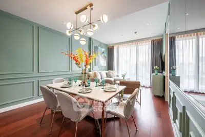 Elegant living room with modern dining area and stylish decor