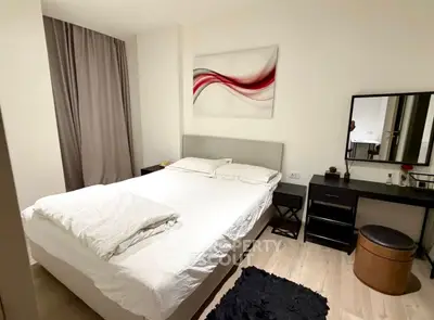 Modern bedroom with stylish decor and cozy ambiance, featuring a comfortable bed and elegant furnishings.