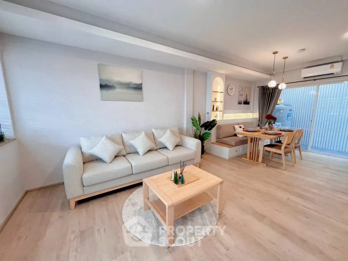 Modern living room with cozy dining area and stylish decor